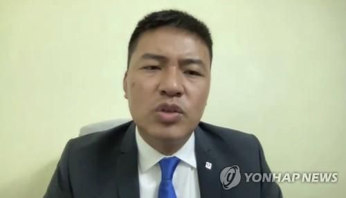 민주진영 국민통합정부 국제협력부 장관 및 대변인을 맡은 사사 박사.[AP=연합뉴스. 재판매 및 DB 금지] [2021.03.17 송고]