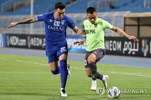 27일 AGMK와의 조별리그 5차전 당시 장현수(왼쪽)[AFP=연합뉴스]