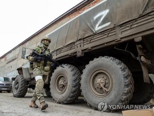 헤르손에 진입한 러시아군[타스 연합뉴스 자료사진. 재판매 및 DB 금지]