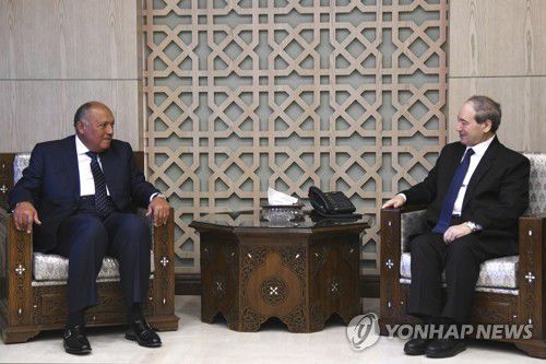 2월 시리아에서 만난 시리아, 이집트 양국 외무장관[AP 연합뉴스 자료사진. 재판매 및 DB 금지]