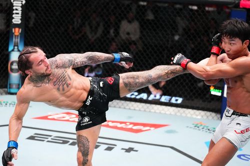 상대 킥을 방어하는 이정영(오른쪽)[UFC 제공. 재판매 및 DB 금지]