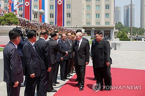 Russia's President Vladimir Putin on state visit to North KoreaNORTH KOREA, PYONGYANG - JUNE 19, 2024: North Korean leader Kim Jong-un and Russia's President Vladimir Putin (R-L front) attend an official ceremony in Kim Il-sung Square to welcome Putin on a state visit. Gavriil Grigorov/Russian Presidential Press and Information Office/TASS