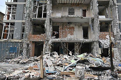 러시아 드론 공격 받은 우크라 건물[AFP 연합뉴스. 재판매 및 DB 금지]