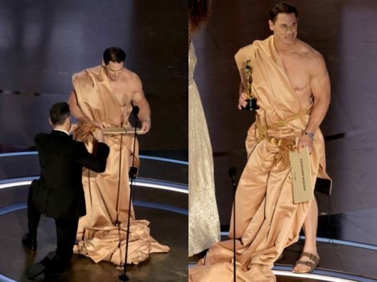 제96회 미국 아카데미 시상식에서 나체로 등장한 배우 존 시나에게 호스트 지미 키멜이 의상을 입혀주고 있다. /AFPBBNews=뉴스1