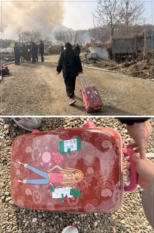 16일 서울 강남구 개포동 구룡마을6일 서울 강남구 개포동 구룡마을에서 한 주민이 캐리어를 든채 화재 현장을 바라보고 있다. /이호준 기자