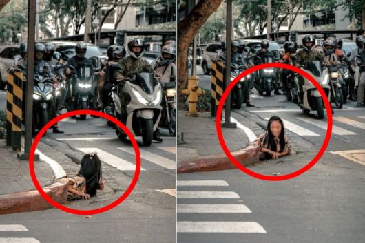 마닐라 번화가 하수구에서 기어 나온 노숙자 / 사진=스트레이츠타임스 홈페이지