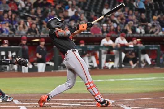 Jul 2, 2025; Phoenix, Arizona, USA;  San Francisco Giants outfielder Jung Hoo Lee (51) hits an RBI triple in the first inning against the Arizona Diamondbacks at Chase Field. Mandatory Credit: Matt Kartozian-Imagn Images연합뉴스