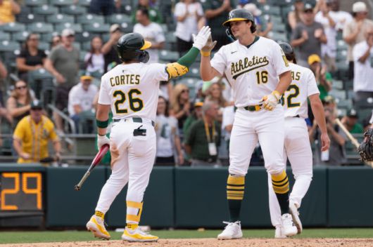 Athletics' Nick Kurtz, right, celebrates with Carlos Cortes, left, after hitting a two-run home run during the eighth inning of a baseball game against the Kansas City Royals, Sunday, Sept. 28, 2025, in West Sacramento, Calif. (AP Photo/Sara Nevis)        <저작권자(c) 연합뉴스, 무단 전재-재배포, AI 학습 및 활용 금지>