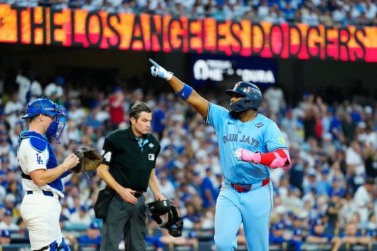 Toronto Blue Jays' Vladimir Guerrero Jr. (27) celebrates his two-run home run while crossing home plate as Los Angeles Dodgers catcher Will Smith (16) and umpire John Tumpane (74) look on during third inning Game 4 World Series playoff MLB baseball action in Los Angeles on Tuesday, Oct. 28, 2025. (Frank Gunn/The Canadian Press via AP) MANDATORY CREDIT        <저작권자(c) 연합뉴스, 무단 전재-재배포, AI 학습 및 활용 금지>