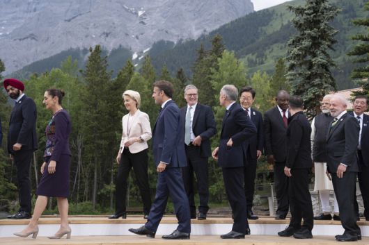 FILE - President of the World Bank Group Ajay Banga, from left, President of Mexico Claudia Sheinbaum, Presdent of the European Commission Ursula von der Leyen, President of France Emmanuel Macron, Britain‘s Prime Minister Keir Starmer, Canada’s Prime Minister Mark Carney, South Korean President Lee Jae-myung, President of South Africa Cyril Ramaphosa, President of Ukraine Volodymyr Zelenskyy, Prime Minister of India Narendra Modi, President of Brazil Luiz Inacio Lula da Silva and Prime Minister of Japan Shigeru Ishiba during a family photo at the G7 leaders‘ summit in Kananaskis, Alberta, Tuesday, June 17, 2025. (Stefan Rousseau/Pool Photo via AP, File) POOL PHOTO FILE PHOTO