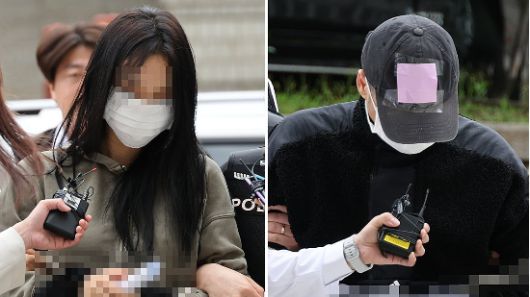 축구 국가대표팀 주장 손흥민의 아이를 임신했다고 주장하며 손씨에게 돈을 뜯어내려 한 20대 여성 양모씨(왼쪽)와 40대 남성 용모씨가 17일 영장실질심사를 받기 위해 서울중앙지법에 들어서고 있다. (사진=연합뉴스)