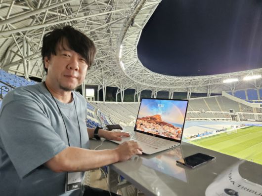 요시자키 에이지 기자.