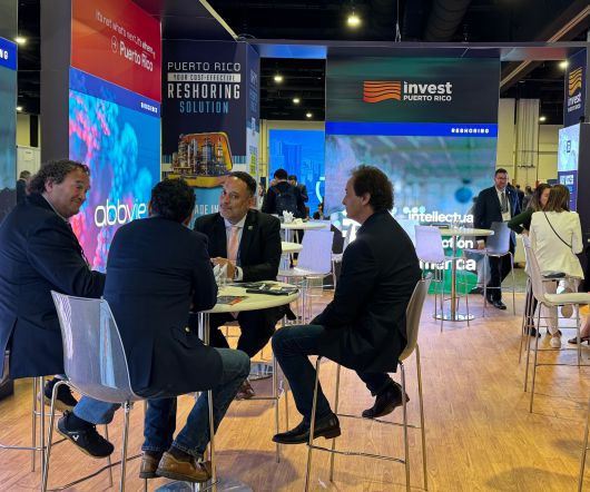 12일 '셀렉트USA 인베스트먼트 서밋' 현장의 푸에르토리코 부스에서 관계자들이 테이블에 앉아 투자 상담을 진행하고 있다. /내셔널하버(메릴랜드주)=김은중 특파원