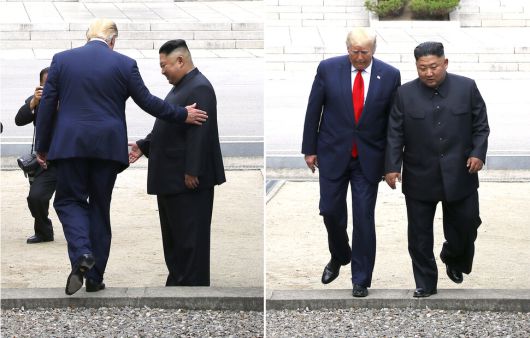 도널드 트럼프 미국 대통령과 김정은 북한 국무위원장이 2019년 6월30일 오후 판문점 군사분계선을 넘어 북쪽으로 함께 걸어갔다 다시 되돌아오고 있다. 연합뉴스