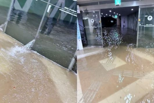 13일 서울 강서구 김포공항 게이트로 물이 쏟아져 들어오고 있다. X(옛 트위터) @King_James_Kim 캡처