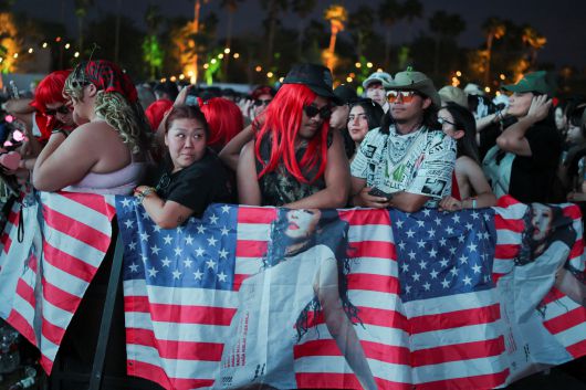 Fans of Jennie gather for her concert at the Coachella Valley Music and Arts Festival in Indio, California, U.S., April 13, 2025. REUTERS/Daniel Cole
