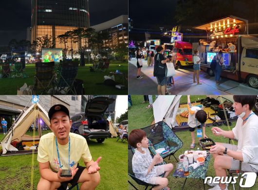 7일 서울 잠실 롯데월드타워 앞 잔디광장에 마련된 '차박존'. 배우 겸 유튜버 강성훈씨(왼쪽 아래)가 도심 차박을 즐기는 소감을 말하고 있다. 유튜버 김용찬씨가 7살, 9살 자녀들과 먹거리를 먹으며 캠핑을 하고 있다.2020.8.7/뉴스1© 뉴스1 최동현 기자