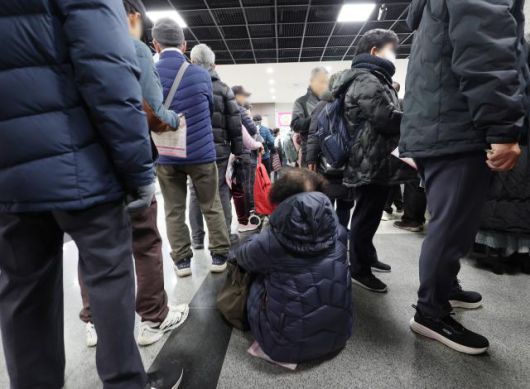 Citizens visiting the Mapo-gu Senior Job Fair held at Mapo-gu Office in Seoul on Dec. 10, 2025, line up to apply for jobs. Yonhap