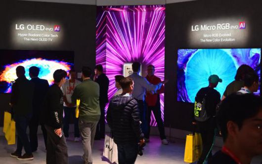 Visitors crowd LG Electronics’ booth in Las Vegas, checking out the company’s 2026 TV lineup, including the LG OLED evo AI W6 and the premium LCD model LG Micro RGB evo/