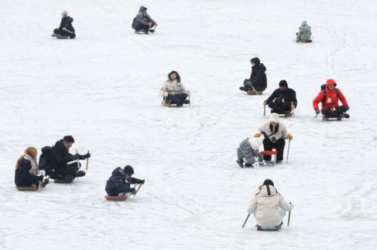 Visitors enjoy snow sled at the Hwacheon Sancheoneo Ice Festival in Hwacheon, Gangwon Province. Jan. 12, 2026. AJP Han Jun-gu