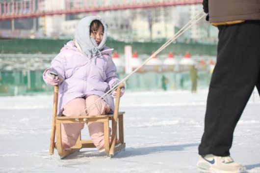 A child rides a snow sled at the Hwacheon Sancheoneo Ice Festival in Hwacheon, Gangwon Province. Jan. 12, 2026. AJP Han Jun-gu