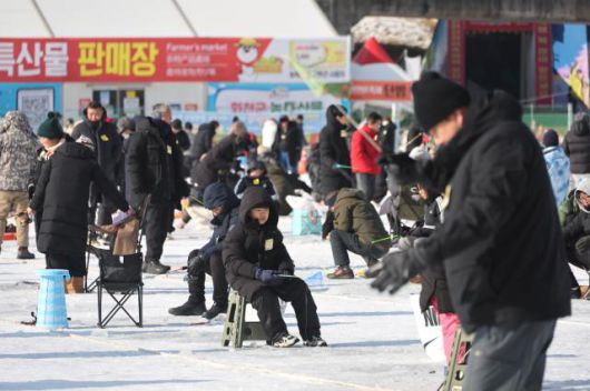 Visitors try ice fishing across the frozen ice field at the Hwacheon Sancheoneo Ice Festival in Hwacheon, Gangwon Province. Jan. 12, 2026. AJP Han Jun-gu