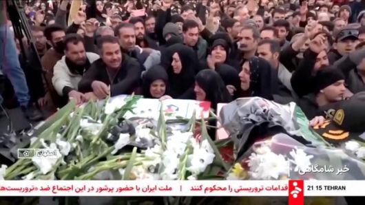 Mourners react next to coffins during a funeral procession for members of security forces and civilians said to be killed in protests on Sunday, amid evolving anti-government unrest, in Tehran, Iran, in this screengrab from a video released on Jan. 11, 2026. AP-Yonhap