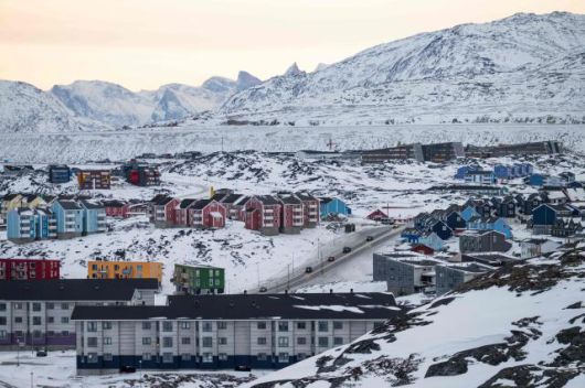 A general view shows residential buildings and a main road in Nuuk, Greenland, during early morning hours on Jan. 22, 2026. AFP-Yonhap