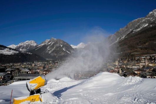 A snow gun sprays artificial snow at the Stelvio Ski Center, venue for the alpine ski and ski mountaineering disciplines at the 2026 Milan Cortina Winter Olympics, in Bormio, Italy, Jan. 16, 2025. AP Yonhap