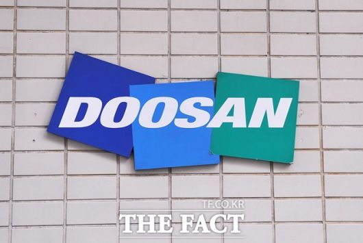 최근 두산그룹의 지배구조 개편에 제동이 걸린 가운데 증권가에선 두산밥캣의 눈높이를 낮췄다. /더팩트 DB