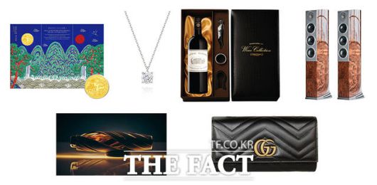CU에서 내놓은 프리미엄 선물세트. 왼쪽 위부터 삼성금거래소 일월오봉도 순금코인 0.1g, 미니골드 1캐럿 다이아 목걸이, 샤또마고 2015, 오디오벡터 네트워크 오디오 패키지, 맥캘란 호라이즌, 구찌 장지갑. /BGF리테일