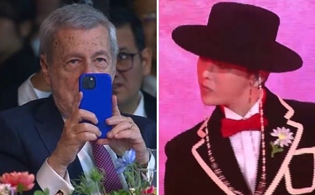 알베르토 반 클라베렌 칠레 외교장관이 31일 경북 경주 라한셀렉트호텔 대연회장에서 열린 ‘2025 APEC 정상회의’ 환영 만찬 공연 무대에 오른 가수 지드래곤을 휴대폰 카메라로 촬영하고 있다. 2025.10.31 연합뉴스TV 화면