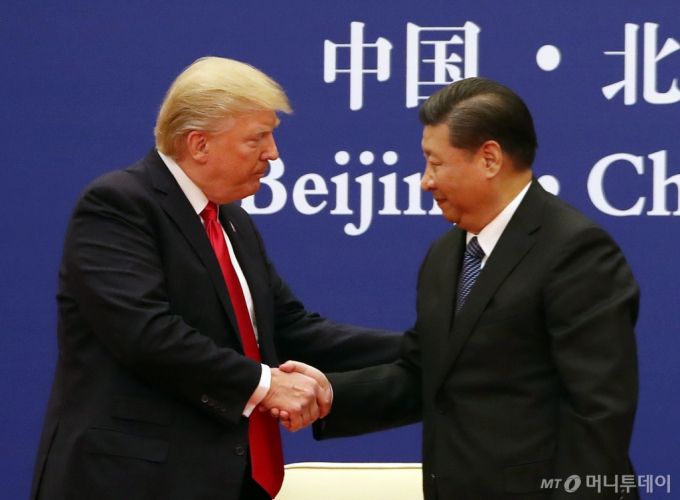 President Donald Trump and Chinese President Xi Jinping XXXXXXX at the Great Hall of the People, Thursday, Nov. 9, 2017, in Beijing, China. Trump is on a five country trip through Asia traveling to Japan, South Korea, China, Vietnam and the Philippines. (AP Photo/Andrew Harnik)