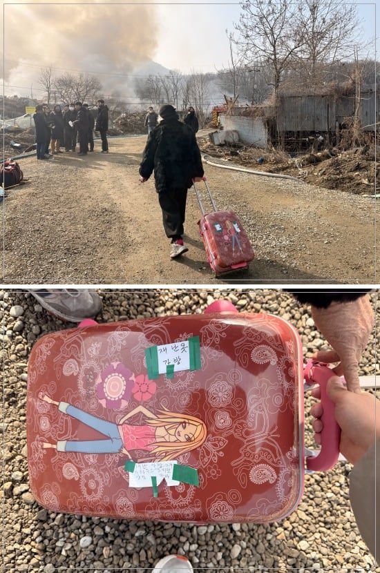 16일 서울 강남구 개포동 구룡마을6일 서울 강남구 개포동 구룡마을에서 한 주민이 캐리어를 든채 화재 현장을 바라보고 있다. /이호준 기자