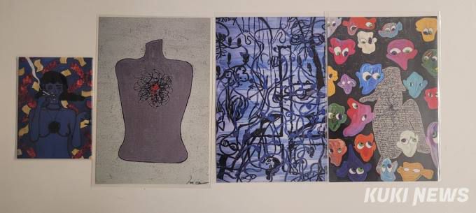 김히어라가 안길호 감독에게 보여준 그림들. 그는 이 그림을 마그넷과 엽서로 제작해 기자들에게 선물했다.   사진=이은호 기자