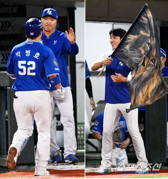 20일 부산 사직야구장에서 열린 삼성과 롯데의 경기, 7회초 삼성 박병호가 추격의 솔로홈런을 날린 후 원태인이 전하는 사자깃발을 지나치고 있다. 부산=허상욱 기자