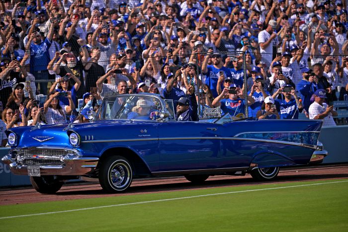 Nov 3, 2025; Los Angeles, CA, USA; Ice Cube delivers the Los Angeles Dodgers Commissioner trophy driving his 1957 Chevrolet Bel Air during the World Series celebration at Dodger Stadium. Mandatory Credit: Jayne Kamin-Oncea-Imagn Images        <저작권자(c) 연합뉴스, 무단 전재-재배포, AI 학습 및 활용 금지>