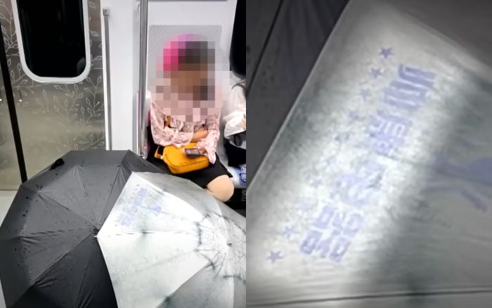 지하철에 탑승한 중국인 승객이 젖은 우산 두개를 펼쳐놓고 말리는 모습이 포착돼 공분을 사고 있다. [사진출처 = JTBC ‘사건반장’ 영상 캡처]