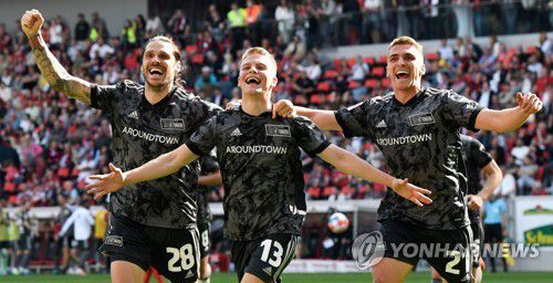 골 세리머니 펼치는 우니온 베를린 선수들[AFP=연합뉴스]