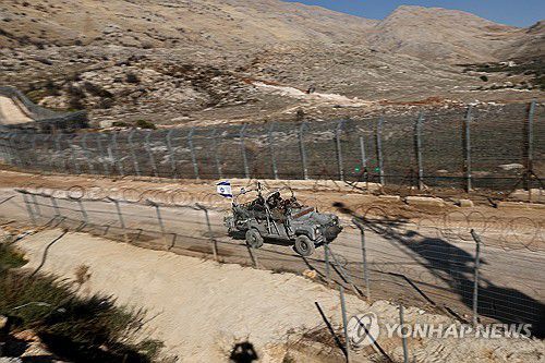 시리아로 진입한 이스라엘 군용차량[EPA 연합뉴스 자료사진]