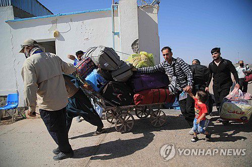 이란 국경에서 본국으로 추방되는 아프가니스탄 난민들[AFP 연합뉴스 자료사진. 재판매 및 DB 금지]