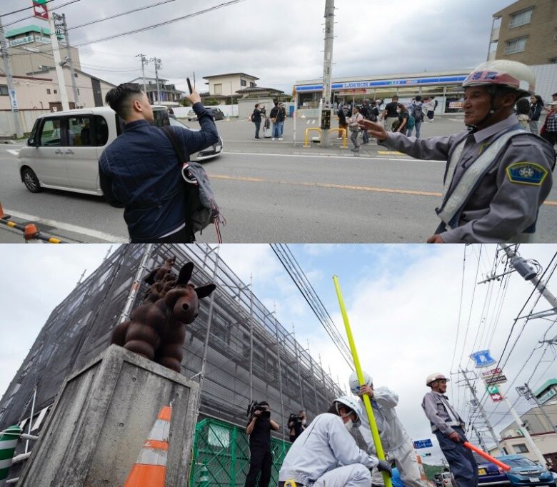 도쿄 가와구치코에 있는 편의점 로손은 이 건물 뒤로 후지산이 펼쳐지는 풍경이 아름다운 것으로 유명하다. 하지만 너무 많은 관광객들이 몰려드는 ‘오버투어리즘’이 일어나면서 지난 30일부터 후지산이 보이지 않도록 상점 지붕위로 높은 장막 설치 공사를 하고 있다. AP 연합뉴스