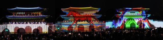 Visitors enjoy a media art show projected against the backdrop of Gwanghwamun Gate during the Seoul Winter Festa, Dec. 12, 2025/ AJP Yoo Na-hyun