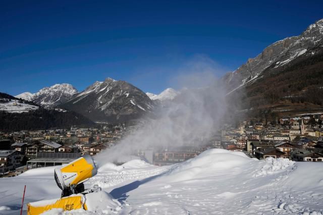 A snow gun sprays artificial snow at the Stelvio Ski Center, venue for the alpine ski and ski mountaineering disciplines at the 2026 Milan Cortina Winter Olympics, in Bormio, Italy, Jan. 16, 2025. AP Yonhap