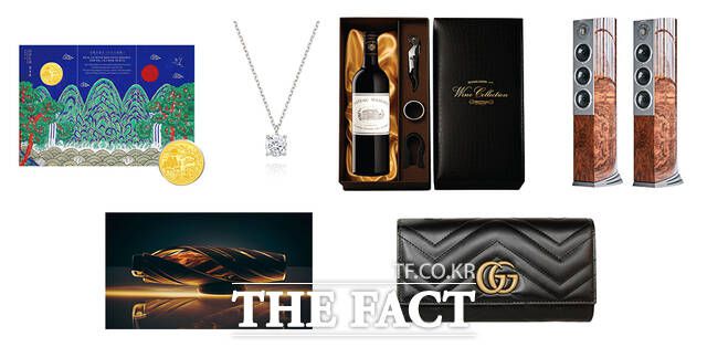 CU에서 내놓은 프리미엄 선물세트. 왼쪽 위부터 삼성금거래소 일월오봉도 순금코인 0.1g, 미니골드 1캐럿 다이아 목걸이, 샤또마고 2015, 오디오벡터 네트워크 오디오 패키지, 맥캘란 호라이즌, 구찌 장지갑. /BGF리테일